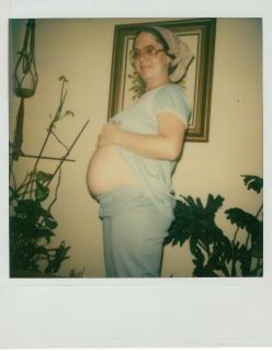5X4.5 POLOROID PICURE OF PREGNANT WOMAN SHOWING HER BELLY