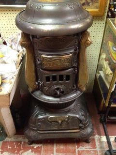 Antique Round Oak Cast Iron Parlor Wood Stove made by P.D.Beckwith 