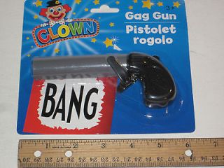 Clown or Magician Plastic Toy Gun   When You Pull The Trigger Banner 