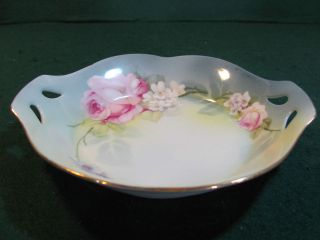 GERMANY 7 INCH BOWL WITH FLORAL DESIGN / CUT OUTS IN HANDLES