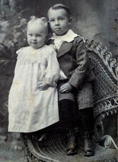   sepia cabinet photo, two darling children in fine wicker chair