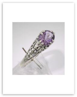  this beautiful filigree ring features a lovely 