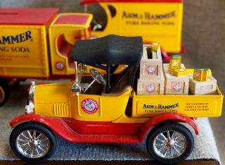 Lot of SEVEN Ertl Arm and Hammer delivery trucks and wagon banks