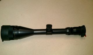   Pro 50 4 12x 50 accutrac BDC rifle scope with VO and butler scope caps