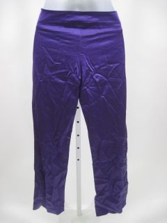 you are bidding on a anna argiolera purple slacks pants in a size 2 