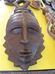 antique african masks and two african figurines