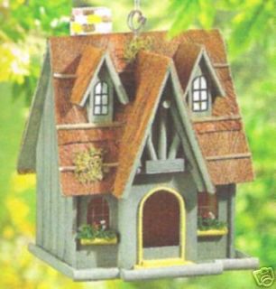 thatched roof cottage bird house nucite