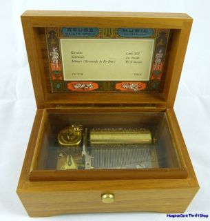 This exquisite wooden music box made by Reuge Music of Sainte Croix 