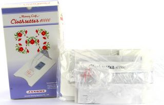   looking at a pristine Janome Memory Craft Sewing & Embroidery Machine