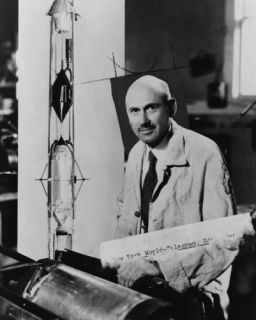 1963 photo Robert H. Goddard , at work in laboratory, with rocket 