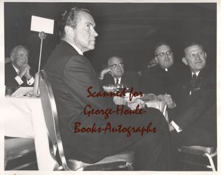   table with actor Charles Buddy Rogers and three unidentified men