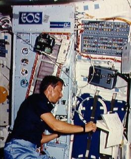 Payload specialist Charles Walker works with CFES experiment