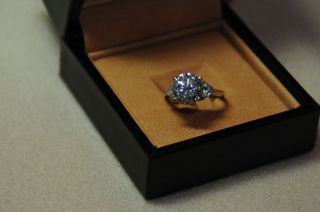 New 3 carat CZ solitaire ring w 2 trillion side stones set in 14k