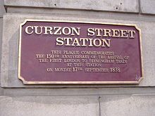 plaque at curzon street station commemorating the arrival of the first