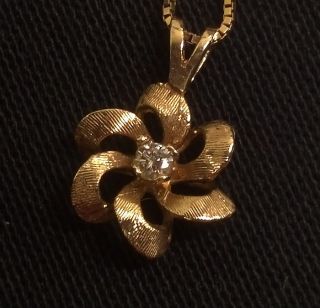 14 Karat Gold Necklace with A Gold and Diamond Pendant 18 inch Chain