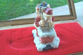 CHRISTMAS FIGURINE OF SANTA ABOUT TO ENTER CHIMNEY VERY COLORFUL HAND