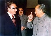  shown here with Henry Kissinger and Zhou Enlai ; Beijing , 1972