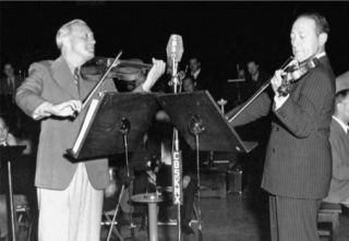 Jack Benny and Jascha Heifetz perform a memorable violin duet