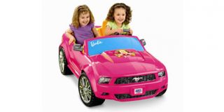 The two speed, battery powered Barbie mobile goes up to 5 mph and has
