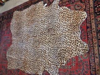 Hand stenciled leopard print cowhide rug