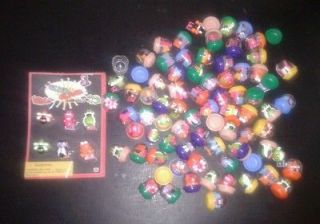 Lot of gumball machine toys and capsules with display card