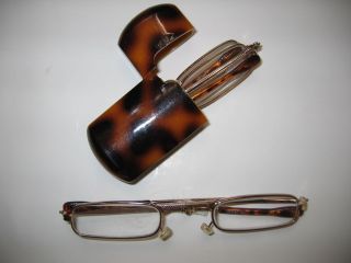 PAIR GOLD FOLDING GLASSES IN A TORTOISE CASE 3x 1 1/2 BY EZ VISION