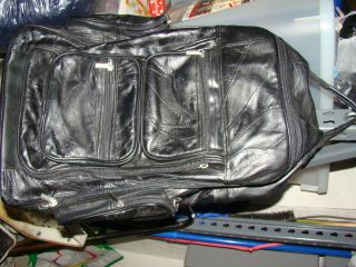 Black Carryon Luggage on wheels w 6 zip storage areas measuring 20h x