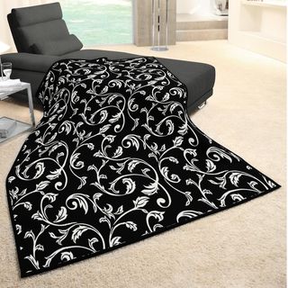 Angelo:home Vine Woven Heather Black Throw (Black, ivoryMaterials: 86 percent acrylic/ 7 percent cotton/ 7 percent polyesterCare instructions: Machine wash, tumble dry Dimensions: 55 inches wide x 70 inches long 100 percent made in GermanyThe digital imag